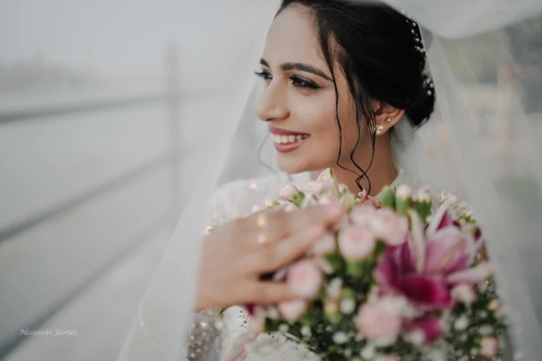 A Christian bride holding bokka in one hand and her next hand on the top of the bokka